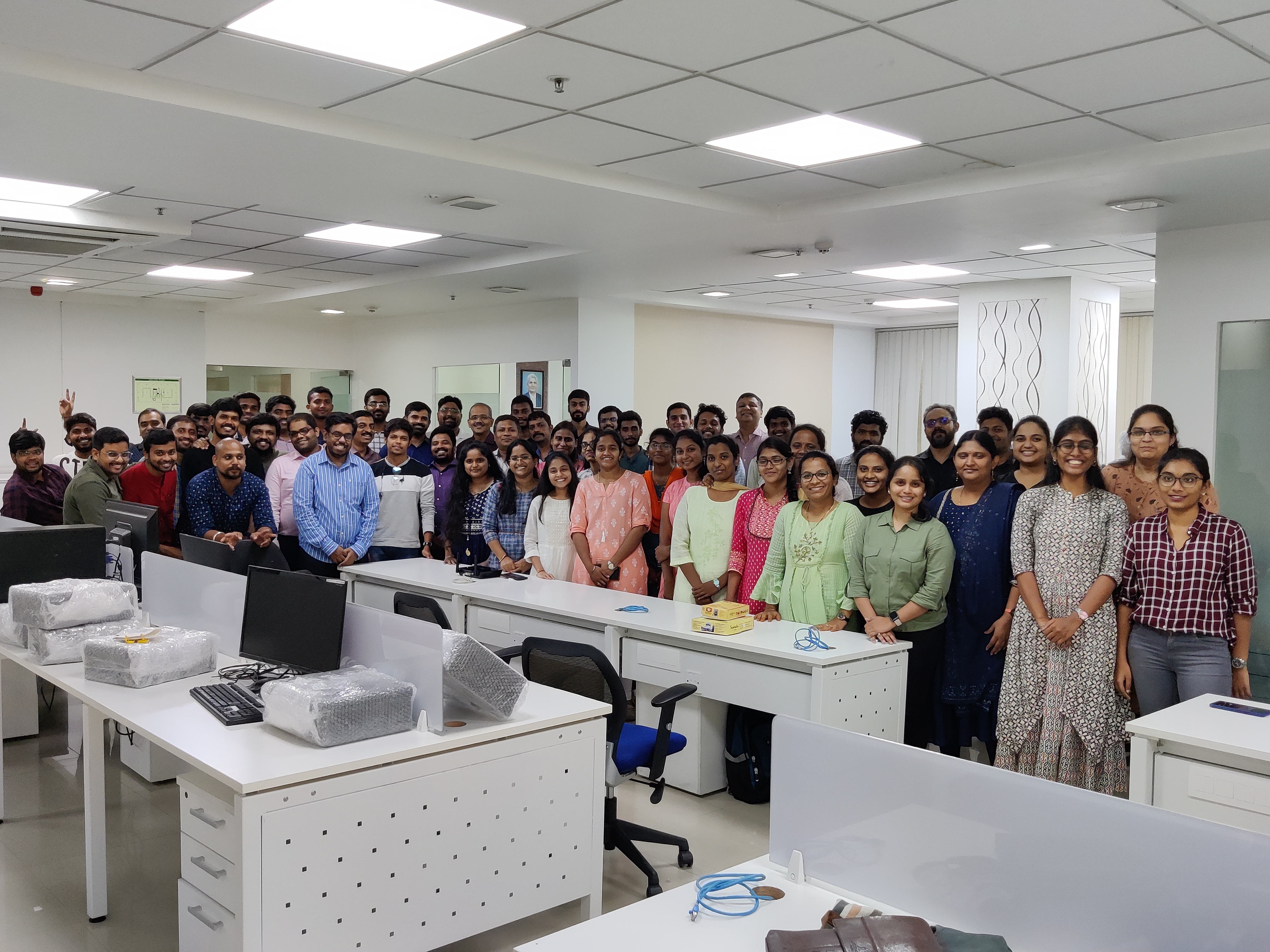 Diverse team members collaborating and building together with wooden blocks in modern office environment